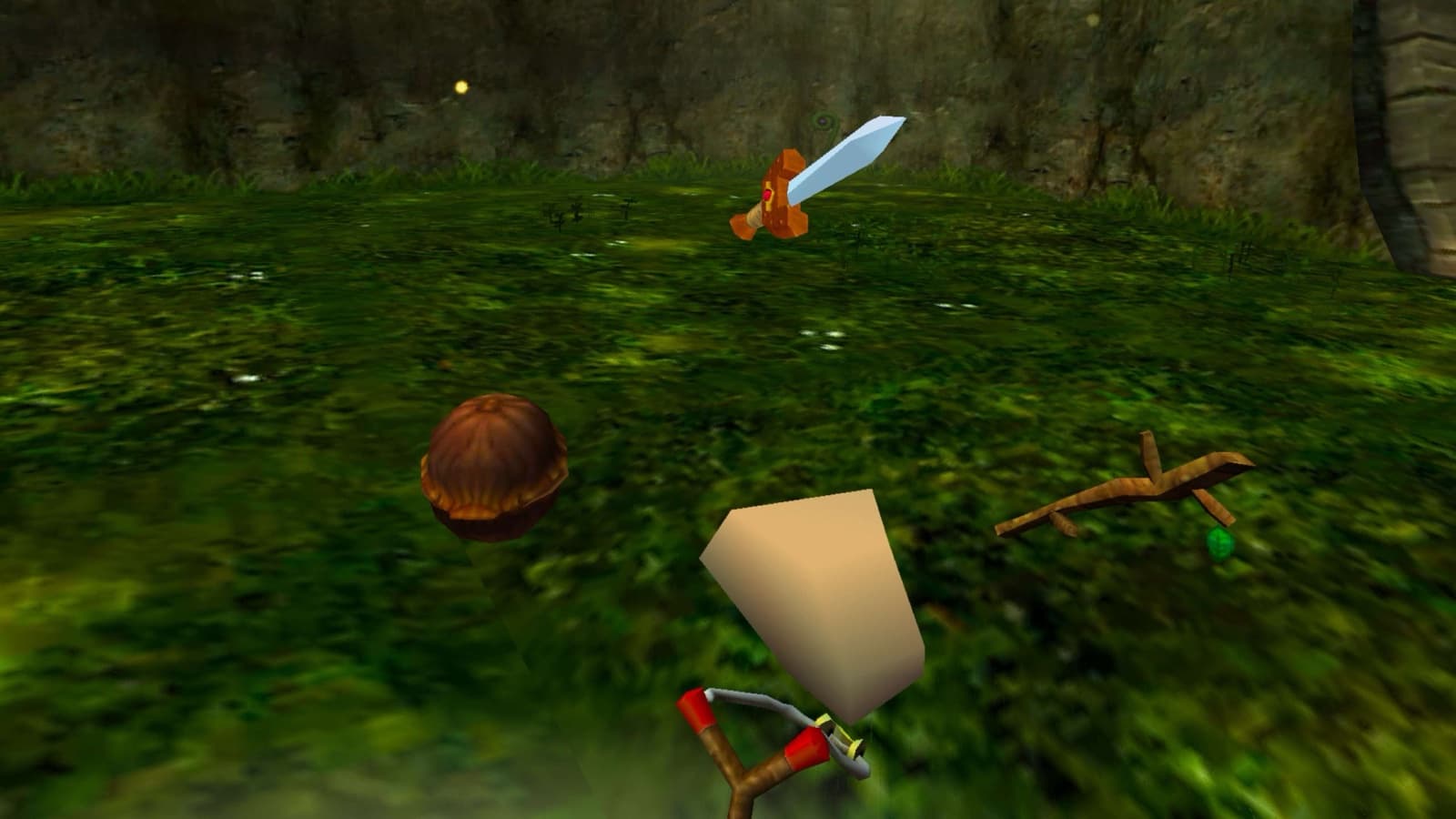 The 3D item picker: a Deku Nut, the Kokiri Sword and a Deku Stick floating around the hand holding the slingshot